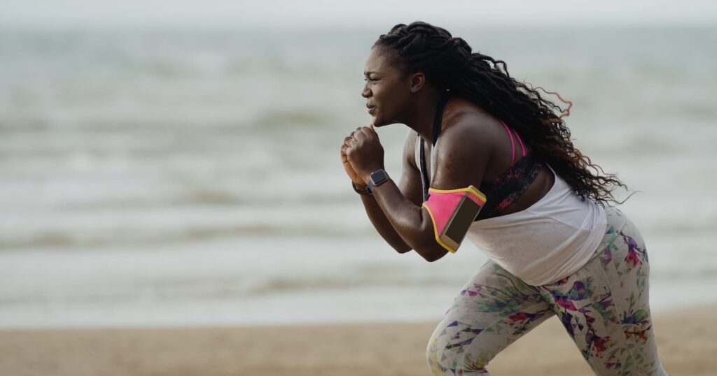 Woman working out on the beach